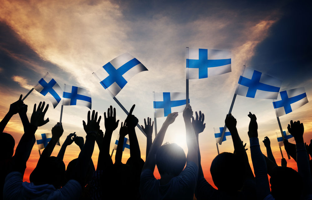 Silhouettes-of-People-Holding-the-Flag-of-Finland
