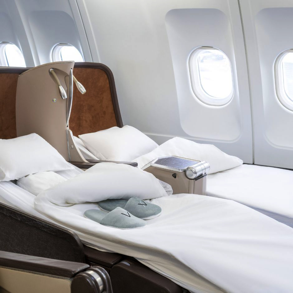 seats-reclined-into-beds-inside-luxury-air-cruise-jet